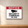 Security Camera in Use Notice aluminum sign in a room mockup