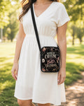 Running on Caffeine and Bad Decisions Crossbody Purse shown worn as an over-the-shoulder purse