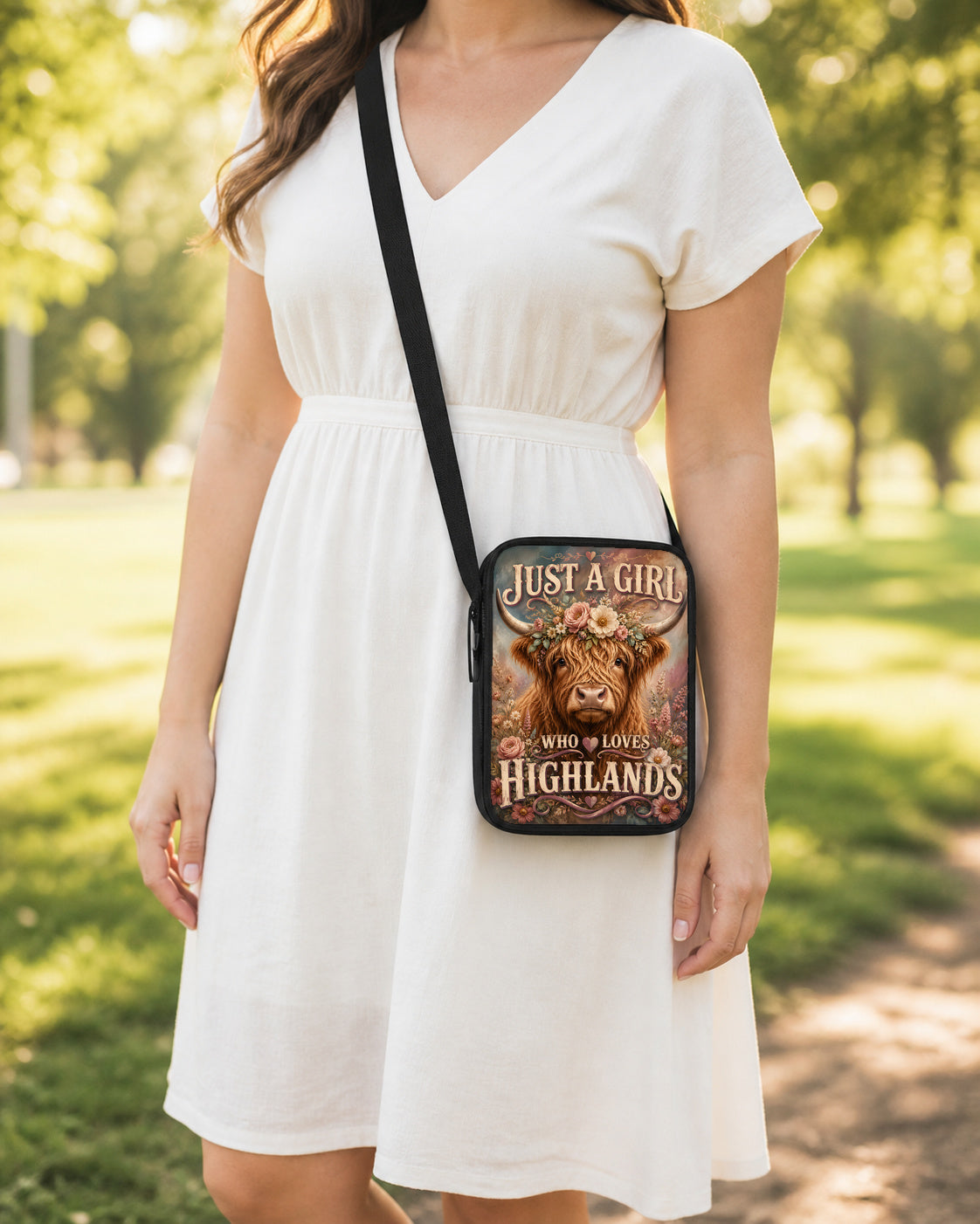 Just a Girl Who Loves Highlands Crossbody Purse shown worn as an over-the-shoulder purse