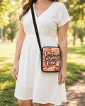 I'm Fine Everything's Fine Crossbody Purse shown worn as an over-the-shoulder purse