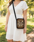 Dog Mom Leopard Crossbody Purse shown worn as an over-the-shoulder purse