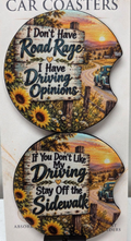 Actual photo of two funny driving quote car coasters with sunflowers and country road design