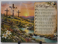 Actual Old Rugged Cross glass cutting board displaying three crosses, hymn sheet music, white lilies, turquoise stream and sunset