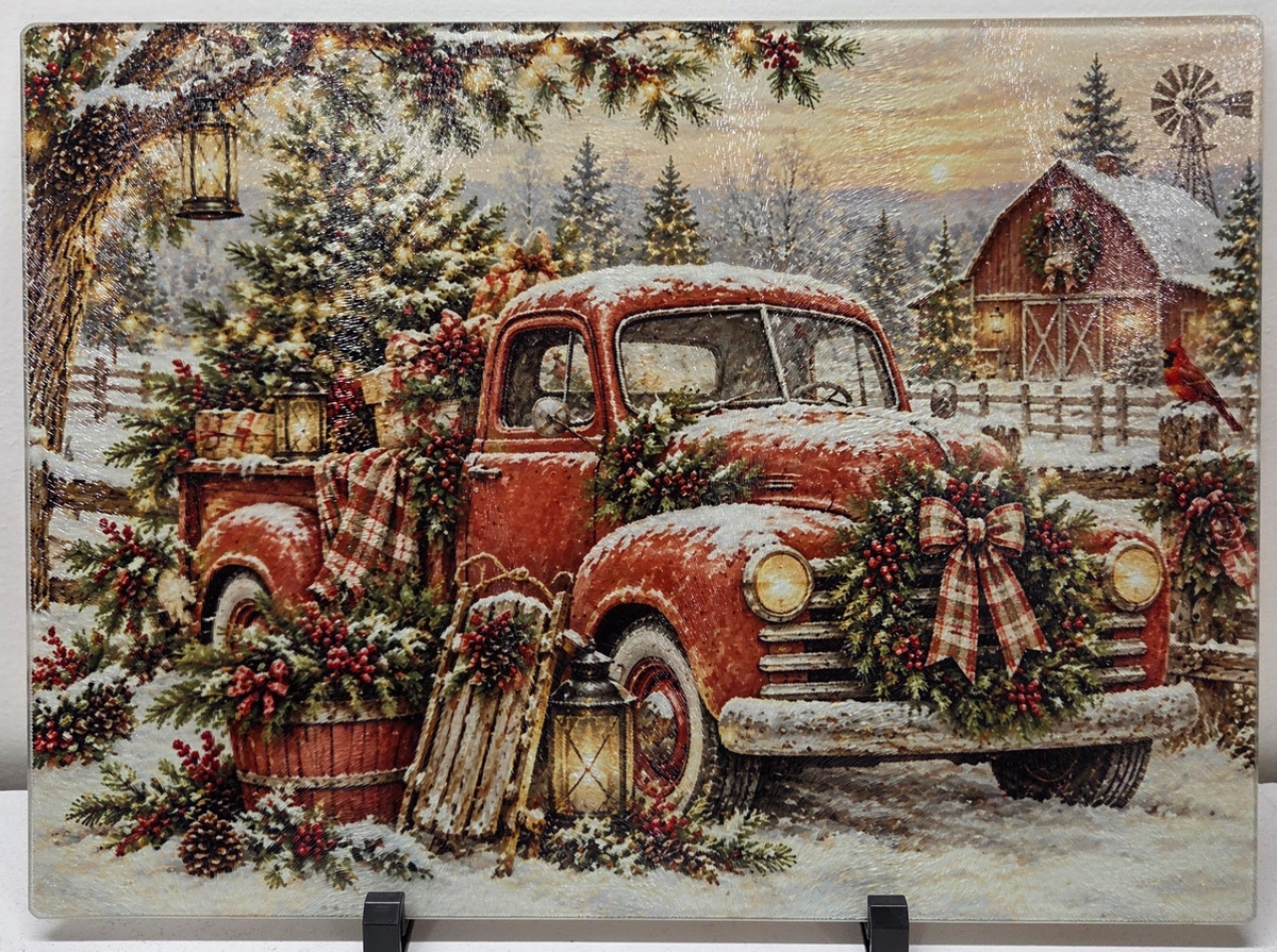 Actual vintage red Christmas truck glass cutting board with snowy farmhouse, wreath, bows, sled and lanterns